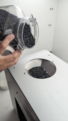 Carbon Fiber being poured into the Filament Extruder